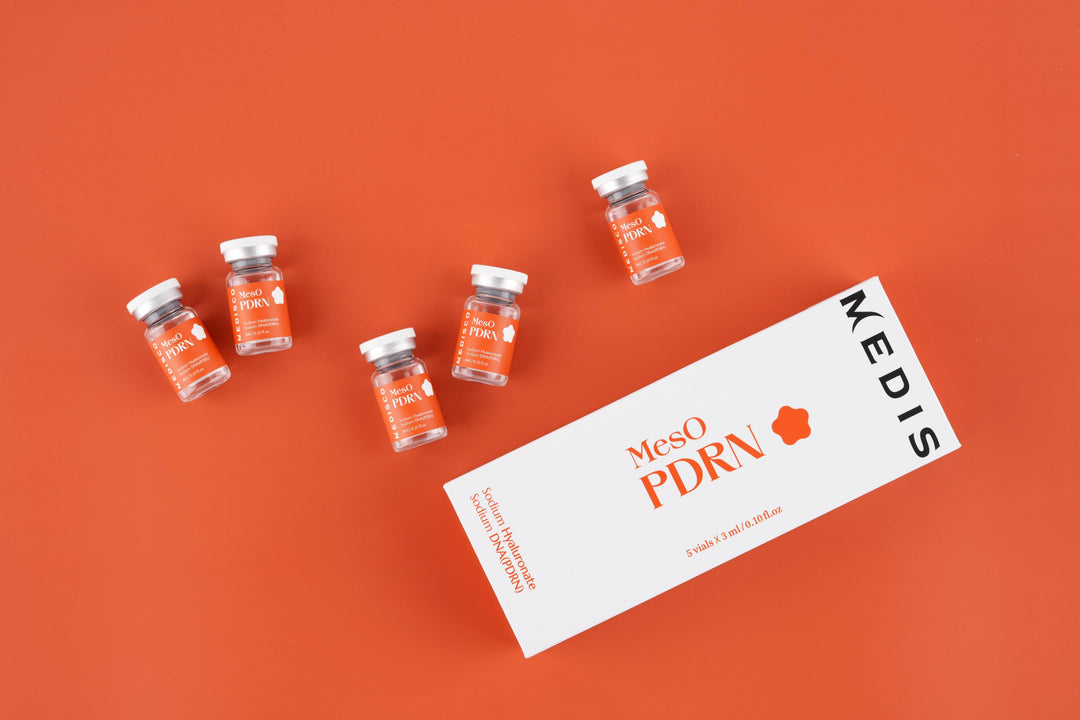 Medisco MesO PDRN Ampoule vials and box arranged on an orange background.