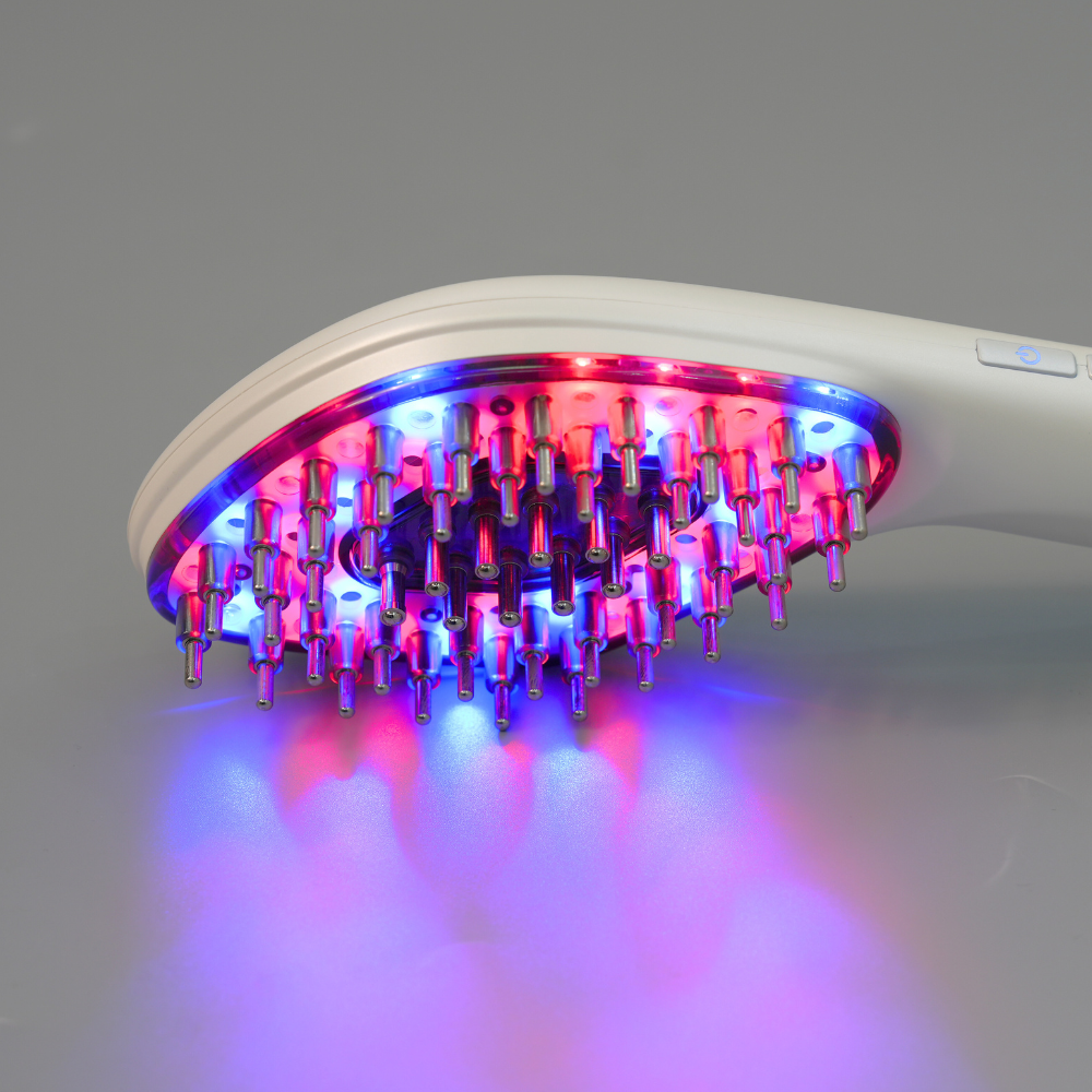 Close up to Reboot Scalp Rejuvenator LED Comb with blue & red LED lights on 