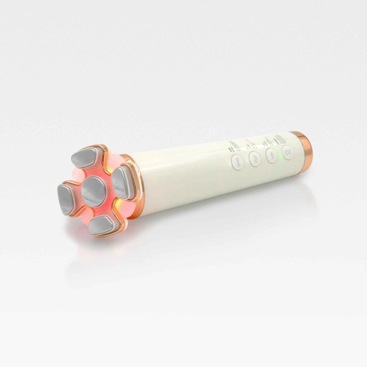 A white and pink electric wand next to a 4-in-1 RF skin tightening and contouring device on a clean surface.