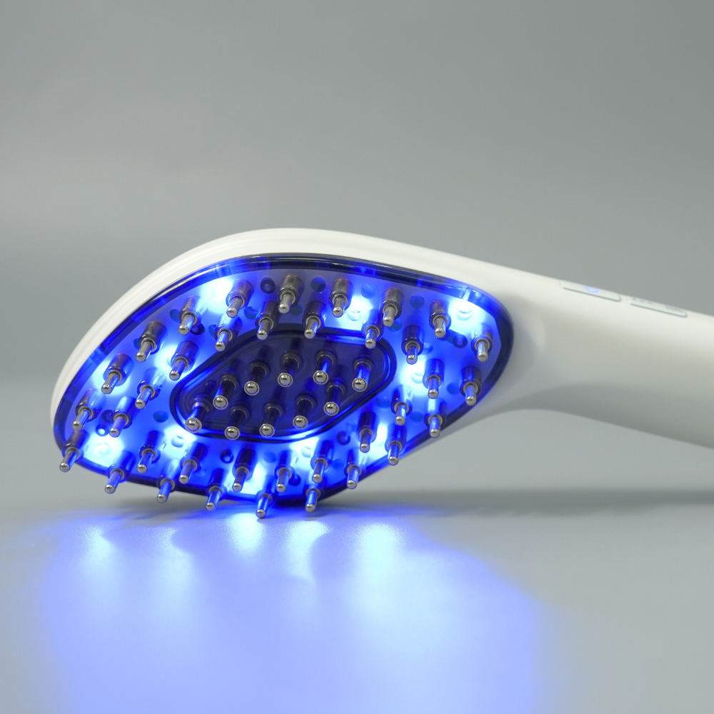 Close up to Reboot Scalp Rejuvenator LED Comb with blue LED lights on 