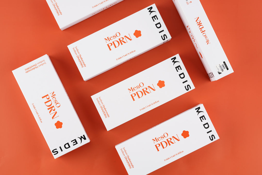 Medisco MesO PDRN Ampoule packaging boxes displayed on a bright orange background.