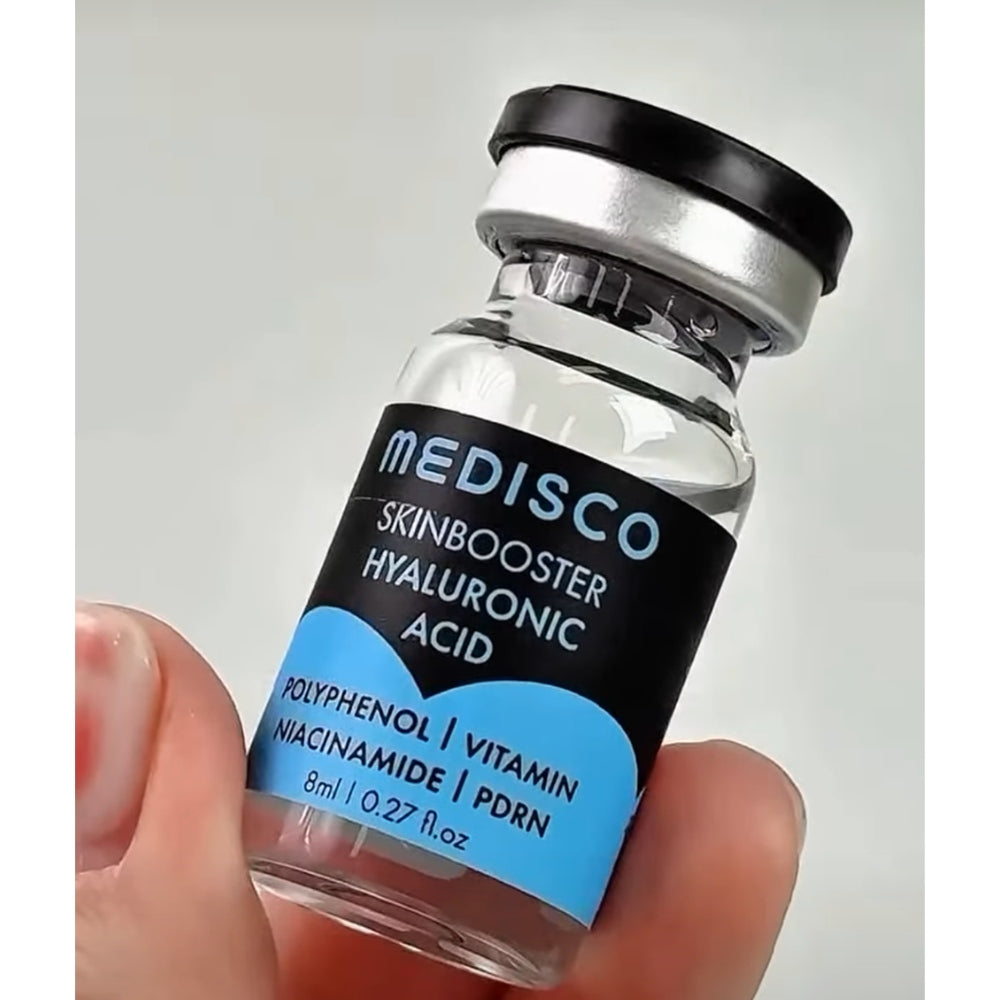 close up to Medisco Skinbooster Hyaluronic Acid  vial held in a hand  