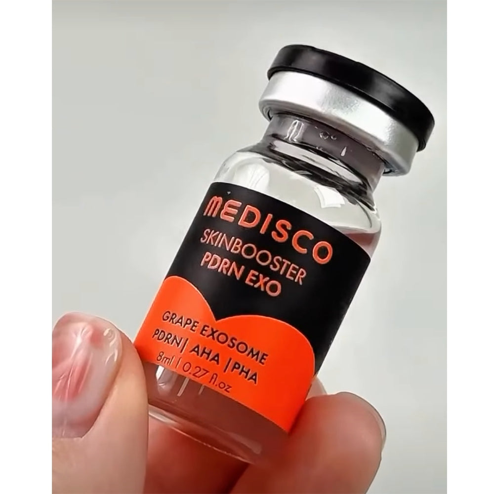 Close up to a hand holding Medisco Skinbooster PDRN EXO vial 