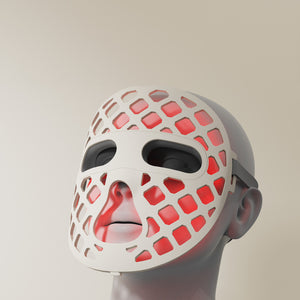 Featuring a red silicone LED light therapy mask, representing the Peachaboo Glo Aurora's advanced technology.