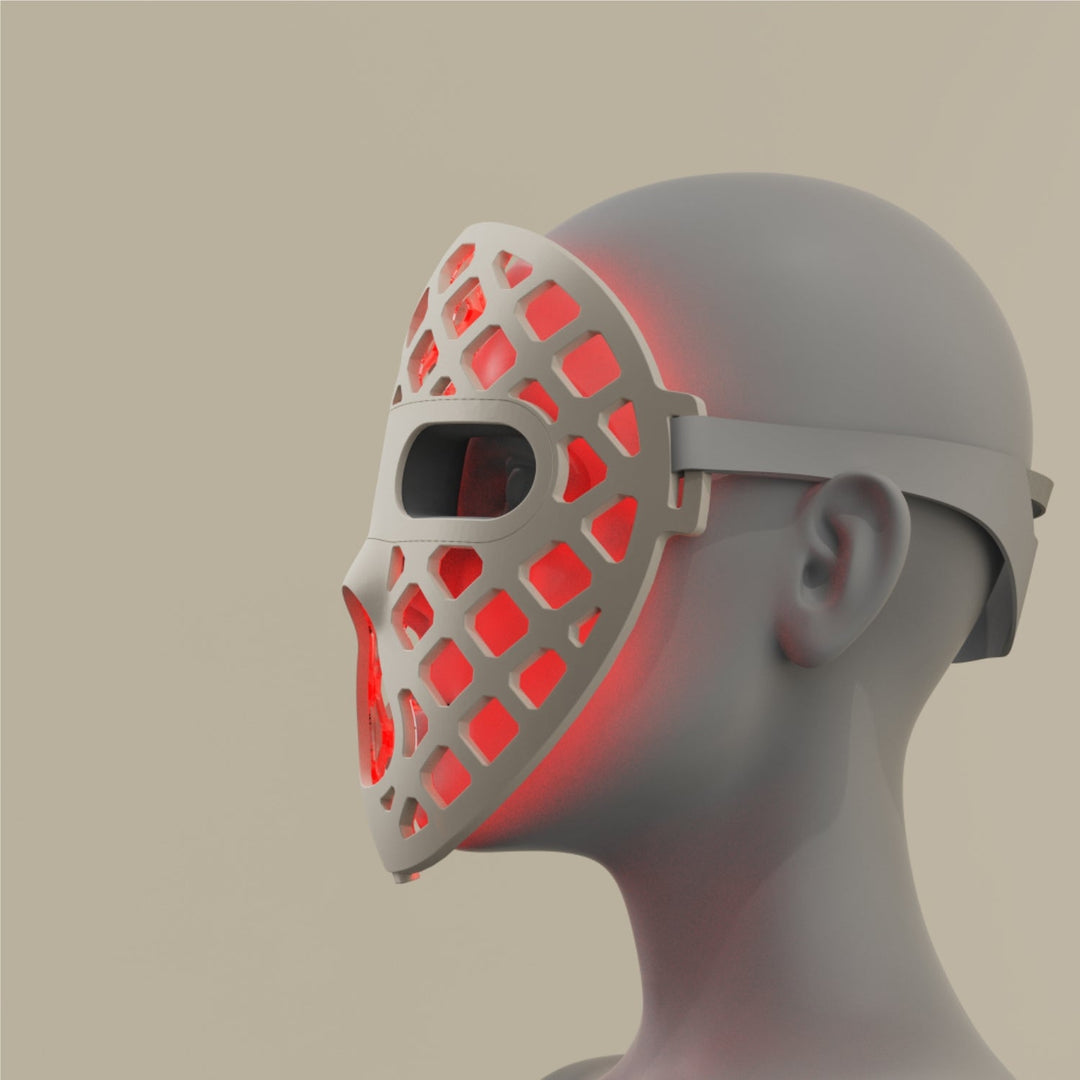 Featuring a red silicone LED light therapy mask, representing the Peachaboo Glo Aurora's advanced technology.