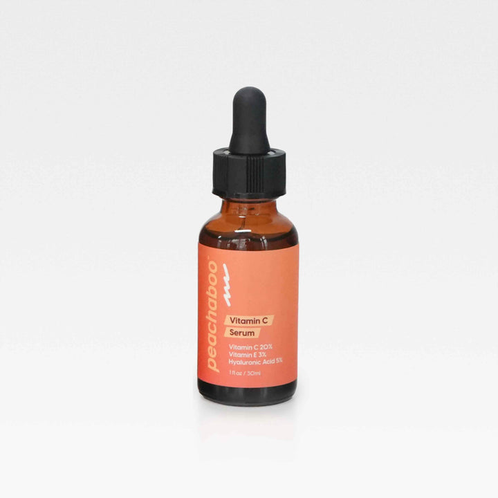  A bottle of Peachaboo Vitamin C Serum displayed on a clean white background, emphasizing its sleek design and vibrant label.