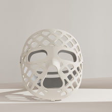 Load image into Gallery viewer, A white mesh-designed mask, the Peachaboo Glo Aurora, featuring LED light therapy technology for skin rejuvenation.