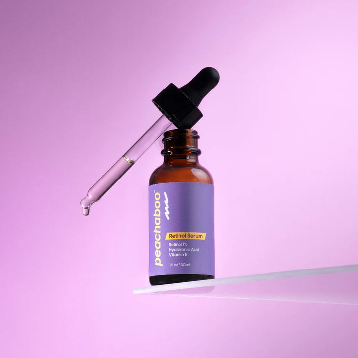 Peachaboo Retinol Serum, purple bottle, with dropper.
