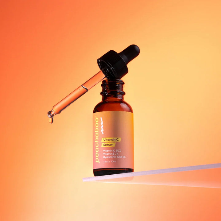 Peachaboo Vitamin C Serum with orange color bottle and dropper.
