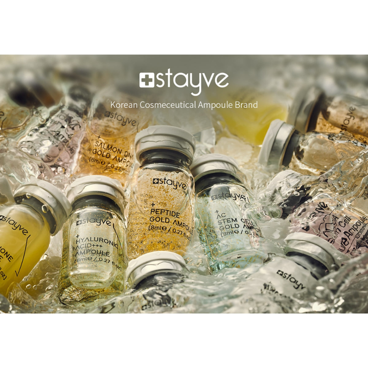 Several Stayve skincare ampoules including Peptide Gold, Hyaluronic Acid and Stem Cell formulas immersing in water. 