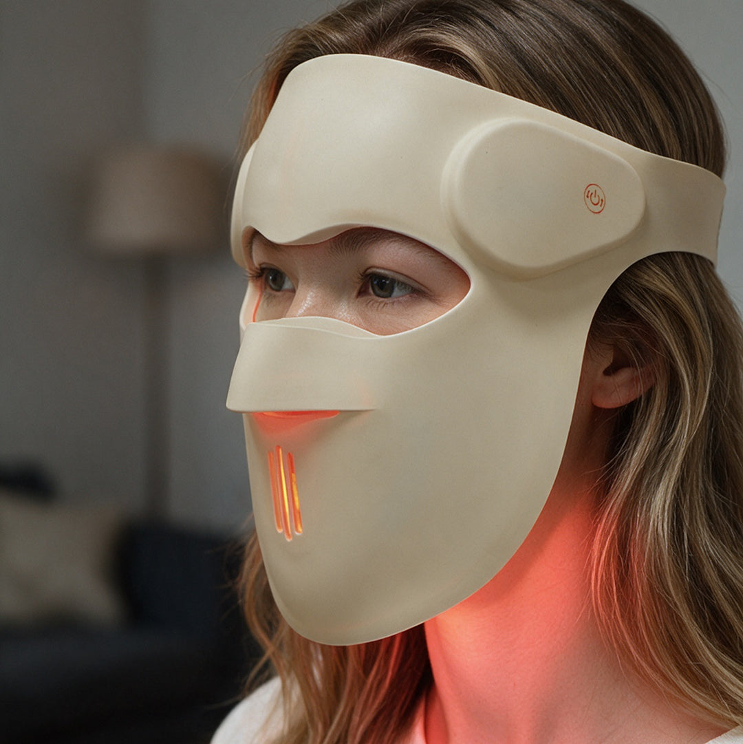 Side view of the Goomi 3D silicone LED mask worn on the face, extending below the chin to light the neck
