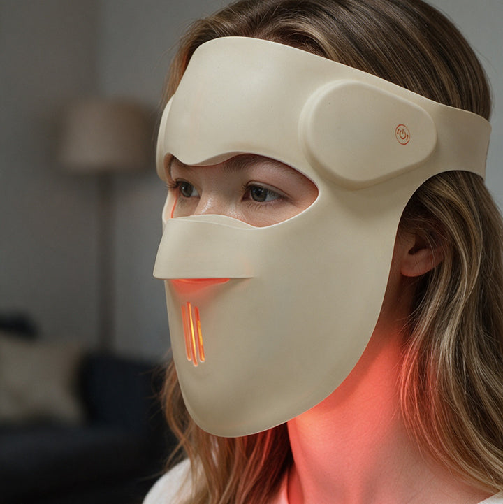 Side view of the Goomi 3D silicone LED mask worn on the face, extending below the chin to light the neck