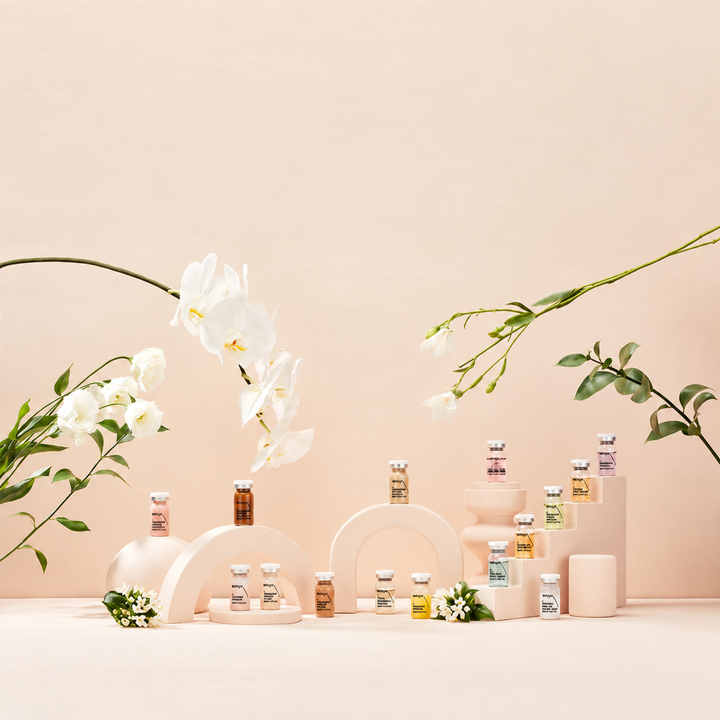 Display of small Stayve vials with flowers on a light peach background. Capacity 8ml x 10 vial per box.