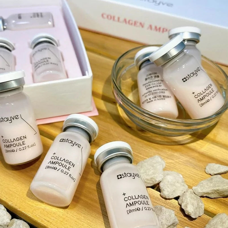Stayve collagen ampoules on a wooden surface with a glass bowl and stones.Stayve collagen ampoules on a wooden surface with a glass bowl and stones.