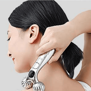 Micro-Current Shaping Device being used on a females neck