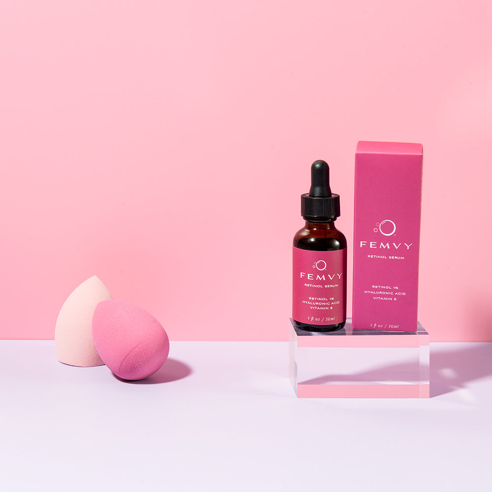 Femvy Retinol Serum on a square stage with pink decoration